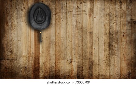 Cowboy hat, against an old barn background.