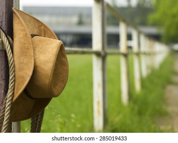 Cowboy Hat And Lasso On Fence American Horse Ranch Background