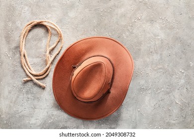 Cowboy Hat And Lasso On Grunge Background