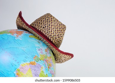 Cowboy Hat On The Globe, Travel And Vacation Concept. Country Music Around The World. Tour Agency And Tourism Service Theme