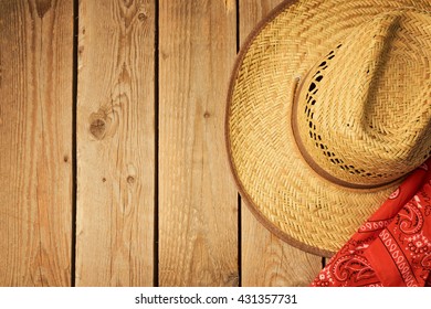 Cowboy Hat On Wooden Vintage Table With Red Bandanna For Party Invitation. View From Above