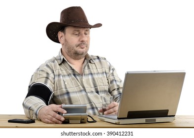 Cowboy Measures Blood Pressure By Himself During Virtual Doctor Visit. This Man Has A Telemedicine Consultation Service. Horizontal Shot. 