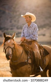 A Cowboy On Horseback In The Western USA.