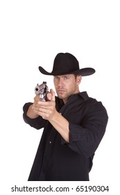 A Cowboy Pointing His Gun And Aiming It At Something With A Serious Expression On His Face.