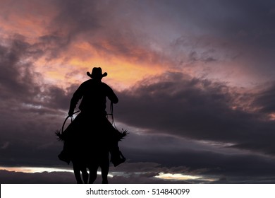 Cowboy Silhouette On A Horse During Nice Sunset