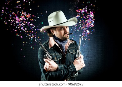 Cowboy In White Hat Shooting Confetti Out Of Two Toy Guns