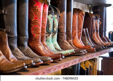 Cowboys boots on a shelf in a store, aligned 