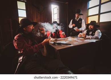 Cowboys group playing poker and card  gambler game in old American west saloon is cowboy vintage life stayle.