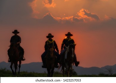 Cowboys are riding horses silhouette in sunset with mountain scene for cowboy group annual meeting in Pakchong, Nakhonratchasima, Thailand taken on  04/29/2019