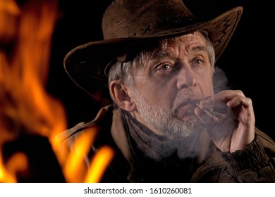 Cowboys Smoke Around The Campfire