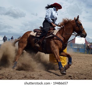 Cowgirl competing in the barrel race