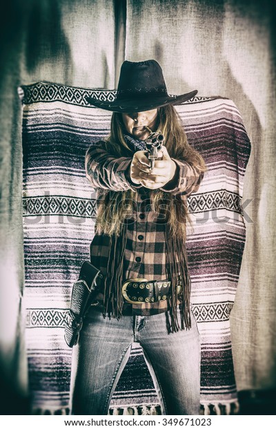 cowgirl-gunslinger-standing-aiming-old-600w-349671023.jpg