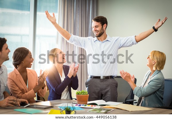 Coworkers Applauding Colleague After Presentation Office Stock Photo ...