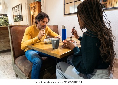 Coworkers Eating Lunch Together In The Office Kitchen And Talking. Co-working Concept.