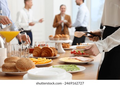 Coworkers having business lunch in restaurant, closeup - Powered by Shutterstock