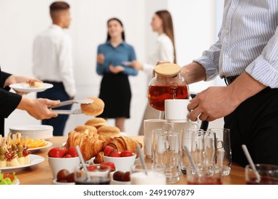 Coworkers having business lunch in restaurant, closeup - Powered by Shutterstock