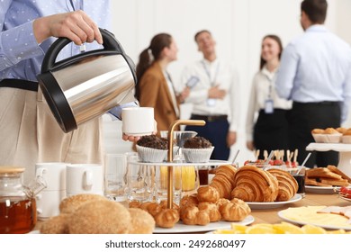 Coworkers having business lunch in restaurant, closeup - Powered by Shutterstock