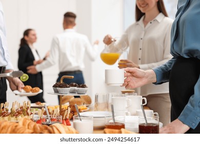 Coworkers having business lunch in restaurant, closeup - Powered by Shutterstock