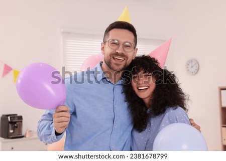 Similar – Young couple celebrating a party with their dog