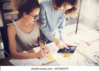 Coworkers Work Process Modern Office Loft.Young Professionals Making Great Decision New Creative Idea.Business Team Working Startup.Digital Tablet Wood Table.Analyze Market Reports.Blurred.Film Effect