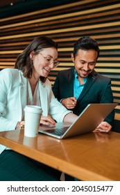 Coworkers Working Together Using Computer