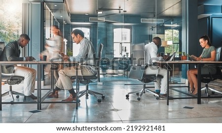 Coworking space, office and sharing desk in corporate workplace. Diversity, efficiency and modern working environment for inclusive company. Start up and motion blur of fast and busy employees