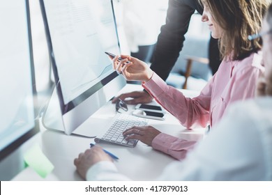 Coworking team process in modern office.Project managers work  idea.Young business crew working with startup studio.Desktop computer table,showing presentation,reflection monitor.Blurred,film effects