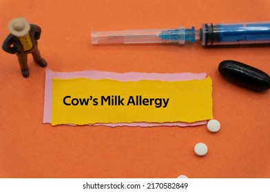 Cow's Milk Allergy.The word is written on a slip of colored paper. health terms, health care words, medical terminology. wellness Buzzwords. disease acronyms.