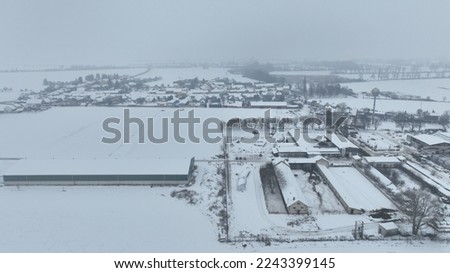 Cowshed warehouse farm barn winter frost snow drone aerial building agricultural breeding cattle pigs, breeding goats, sheep horses. Village snowy ice Stetovice farming farmer stock snowfall. Europe