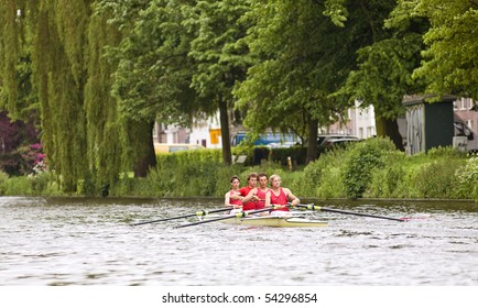 A Coxed Four On A Canal At Full Speed