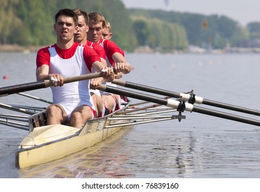 Coxed Four Rowing Team During The First Strokes After The Start Of A Race