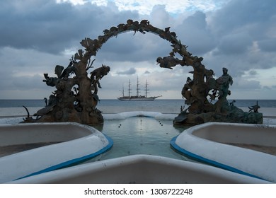 Cozumel Scuba Reef  Fountain With A Sailboat Cruise Ship