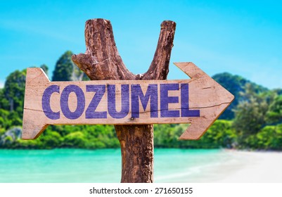 Cozumel Wooden Sign With Beach Background