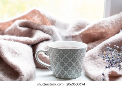 Cozy autumn composition with warm blanket, cup of hot tea and dry lavender bouquet. Hygge style composition. - Powered by Shutterstock