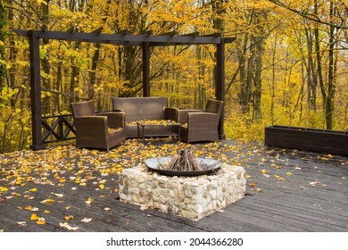 Cozy Autumn Patio With Chairs, Hearth And Firewoods.Exterior In Backyard For Relax In Autumn Garden. Fall Decor. Selective Focus.