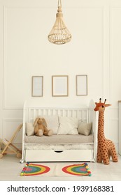 Cozy baby room interior with crib and toys