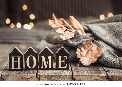 Cozy Background With Wooden Letters With The Inscription Home . The Concept Of Home Atmosphere And Comfort.