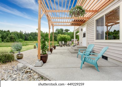 Cozy backyard patio area with table set and nice landscaping desing
