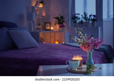 cozy bedroom in  evening with flowers and tea - Shutterstock ID 2159920103