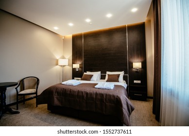 Cozy Bedroom Interior In A Contemporary Design. The Hotel Room Is In Pastel Brown.