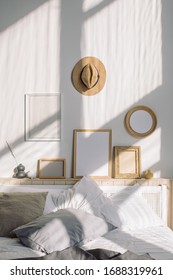 Cozy Bedroom With Various Photo Frames Mockups Hanging On White Wall. Scandinavian Interior.