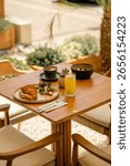 Cozy Café Breakfast Spread on Rustic Wooden Table

