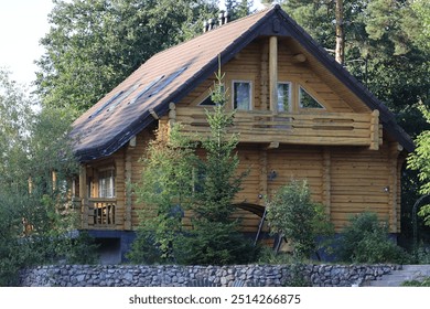 Cozy cabin with a black roof and wooden walls. - Powered by Shutterstock