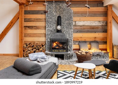 A Cozy Cabin Interior With A Burning Fireplace