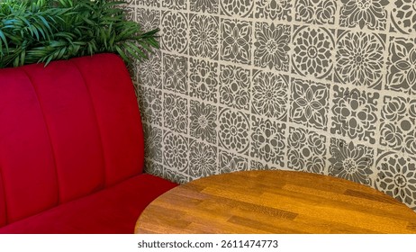 Cozy cafe corner with red seating, wooden table, decorative wall tiles, inviting relaxation - Powered by Shutterstock - Get 15% off with code: PIKWIZARD15