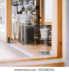 a cozy cafe corner and roasted coffee beans in a jar  - Powered by Shutterstock