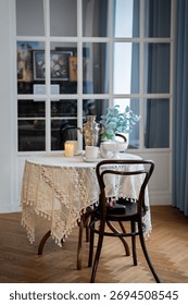 Cozy Cafe Table Setup with Candle and Flowers