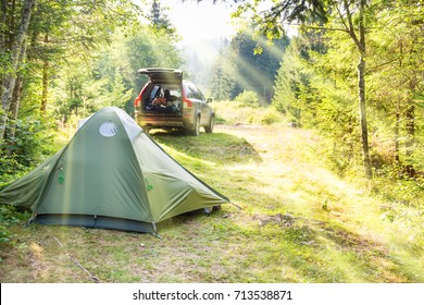 Cozy Camping On Green Sunny Lawn With Tent And A Car