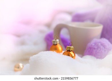 Cozy Christmas Home Decor. 
White Cup And Fluffy Toy With  Golden Christmas Bauble. Festive Decorations. Shallow DOF