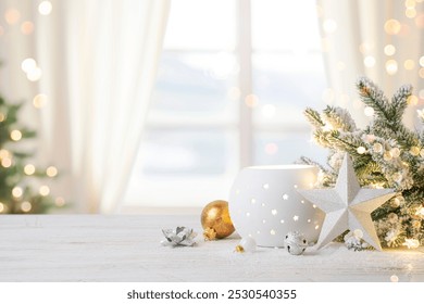 Cozy Christmas table top with decorations and snow on blur abstract holiday background - Powered by Shutterstock